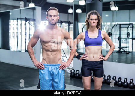 Attentive muscular couple looking at the camera Stock Photo