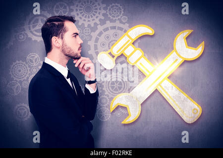 Composite image of thoughtful businessman touching his chin Stock Photo