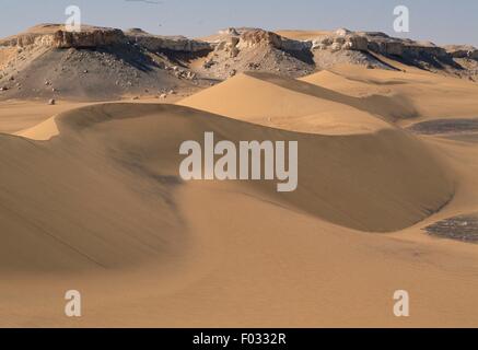 Dunes and rocks, near Dakhla Oasis, Lybian Desert, Sahara Desert, Egypt. Stock Photo