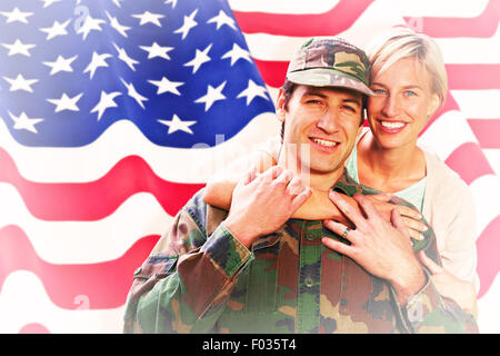 Composite image of army wife reunited with husband Stock Photo