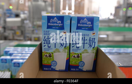 Zeven, Germany. 05th Aug, 2015. Milk cartons to be sold in China are packaged at a local branch of German milk company Deutscher Milchkontor (DMK) in Zeven, Germany, 05 August 2015. Photo: Carmen Jaspersen/dpa/Alamy Live News Stock Photo