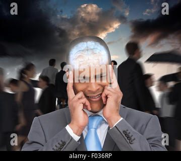 Composite image of stressed businessman putting his fingers on his temples Stock Photo