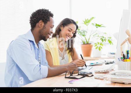 Smiling colleagues working together Stock Photo