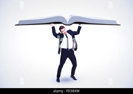 Composite image of businessman in suit lifting up something heavy Stock Photo