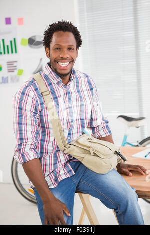 Young businessman smiles at the camera Stock Photo