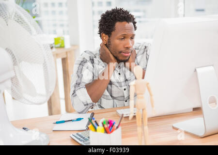 Young businessman looking at his computer screen Stock Photo