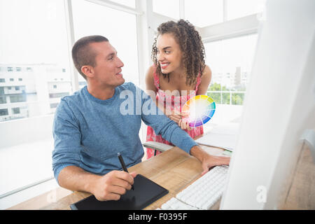 Creative business colleagues looking at each other Stock Photo