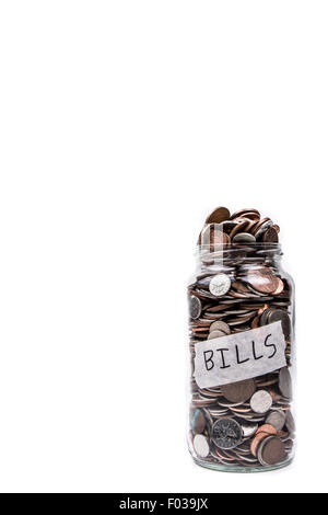 An Overflowing Change Jar Labeled Bills Stock Photo