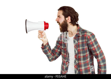 Handsome hipster shouting through megaphone Stock Photo