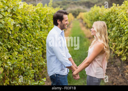 Young happy couple holding hands Stock Photo