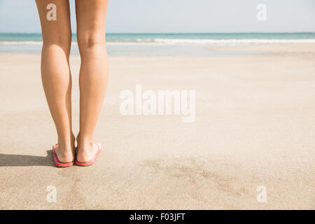 Woman standing on the sand Stock Photo