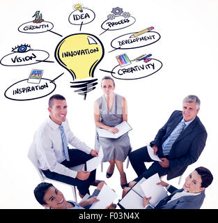 Composite image of business team sitting in circle and discussing Stock Photo