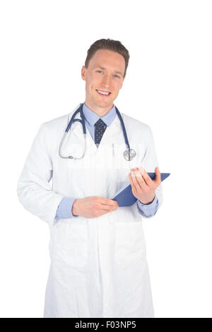 Smiling doctor holding a digital tablet Stock Photo