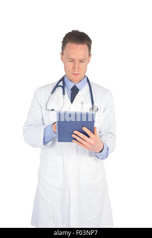 Serious doctor using a digital tablet Stock Photo