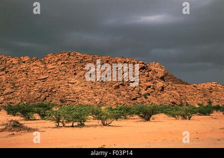 Stormy clouds over the rocky desert at the Damaraland Wilderness Area, Namibia.