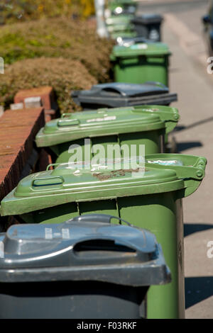 Wheelie bins awaiting collection on a street in England. Stock Photo