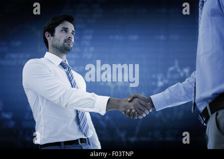 Composite image of two businessmen shaking hands in office Stock Photo