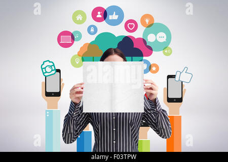 Composite image of smiling woman showing a big business card in front of her face Stock Photo