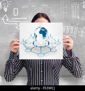 Composite image of smiling woman showing a big business card in front of her face Stock Photo