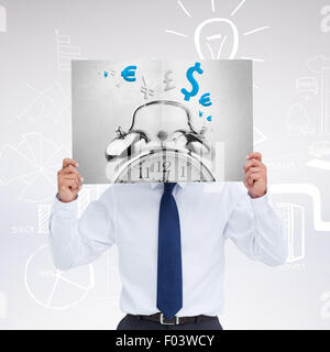 Composite image of tradesman holding blank sign in front of his head Stock Photo