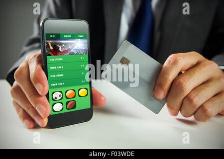Composite image of businessman using smartphone Stock Photo