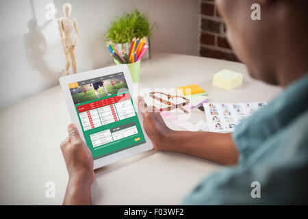 Composite image of photo editor using tablet pc Stock Photo