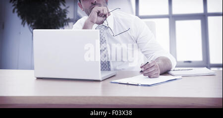 Businessman working at his desk Stock Photo