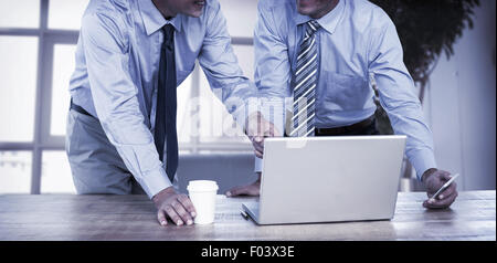 Businessmen using laptop Stock Photo