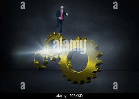 Composite image of smiling young businessman in suit running Stock Photo