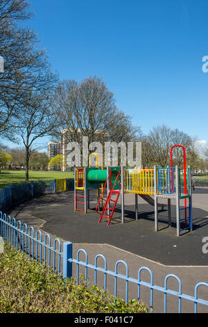 Childrens playground near blocks of flats in a city in England. Stock Photo