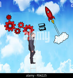 Composite image of happy businessman standing on ladder Stock Photo