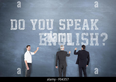 Composite image of business team writing Stock Photo