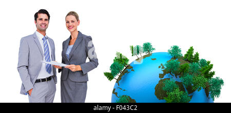 Composite image of business people looking at camera Stock Photo