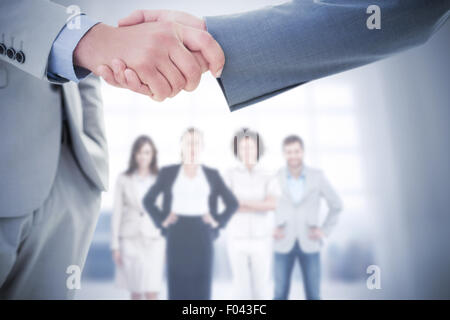 Composite image of business handshake Stock Photo