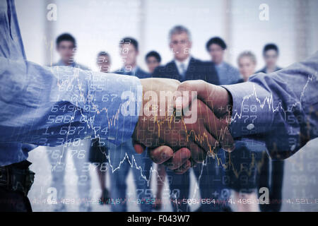 Composite image of two men shaking hands Stock Photo