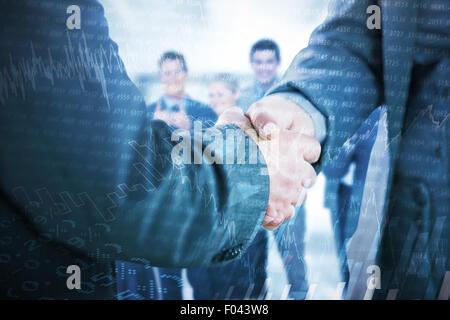 Composite image of business people shaking hands close up Stock Photo