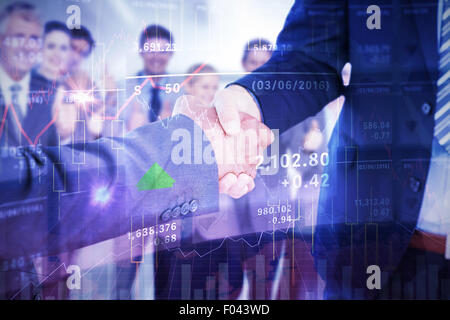Composite image of businessmen shaking hands Stock Photo