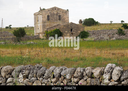 Farmhouse stone wall boundary in Apulia Italy. Stock Photo