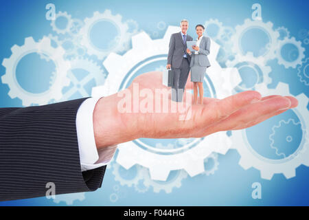 Composite image of business people using tablet computer Stock Photo