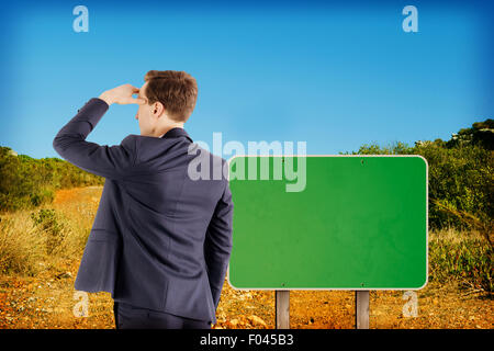 Composite image of wear view of businessman looking away Stock Photo