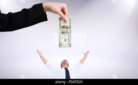 Composite image of businesswomans hand holding hundred dollar bill Stock Photo