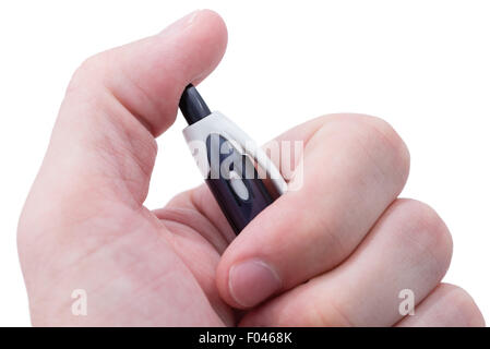 A macro shot of a man's hand clicking a black ballpoint pen. Stock Photo