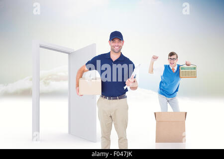 Composite image of delivery man with package and clipboard on white background Stock Photo
