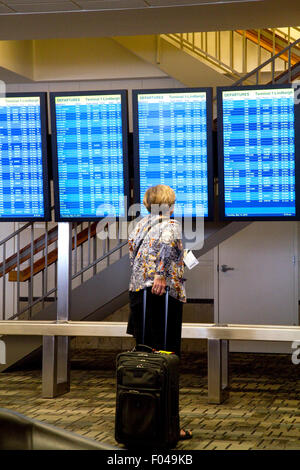 Digital flight information display monitors at the Minneapolis-Saint Paul International Airport located in Hennepin County, Minn Stock Photo