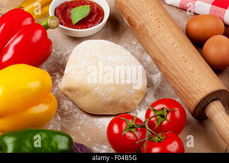 Pizza cooking ingredients. Dough, vegetables and spices Stock Photo