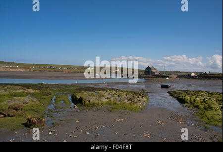 Low tide at Newport, Pembrokeshire looking towards the boat club. The Club is housed in an ancient warehouse Stock Photo