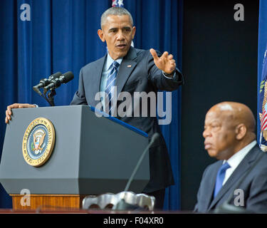 Washington DC, USA. 06th Aug, 2015. Georgia. 6th Aug, 2015. United States President Barack Obama makes remarks at a session hosted by the White House Office of Public Engagement on strengthening and protecting the right to vote at the White House in Washington, DC on Thursday, August 6, 2015. The event was attended by civil rights leaders, faith leaders, voting rights activists and state and local officials. At right is US Representative John Lewis (Democrat of Georgia.) Credit: Ron Sachs/Pool via CNP - NO WIRE SERVICE - © dpa/Alamy Live News Credit:  dpa picture alliance/Alamy Live News Stock Photo