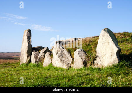 West Kennet Long Barrow, Neolithic tomb, burial mound on a chalk ridge near Silbury Hill. Large sarsen stones standing at entrance to barrow. Stock Photo