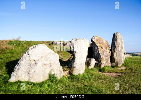 West Kennet Long Barrow, Neolithic tomb, burial mound on a chalk ridge near Silbury Hill. Large sarsen stones standing at entrance to barrow. Stock Photo