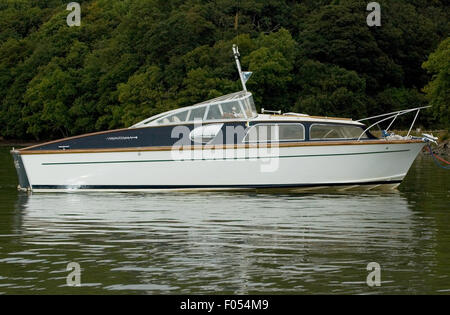 Profile of Classic power boat from the 1960's moored on the River Dart. Stock Photo